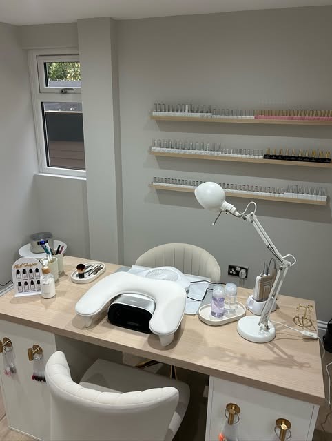 The MD Nails studio: a single treatment desk and the polish wall